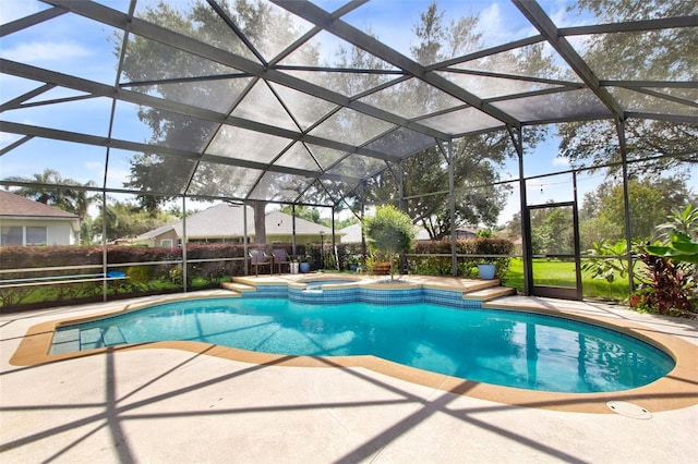 view of swimming pool featuring glass enclosure, an in ground hot tub, and a patio