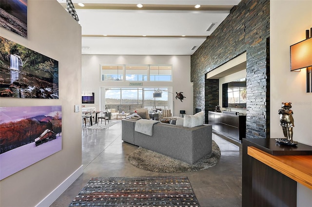 living room featuring a high ceiling