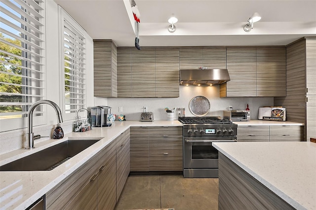 kitchen featuring tile patterned flooring, sink, stainless steel range, light stone countertops, and ventilation hood