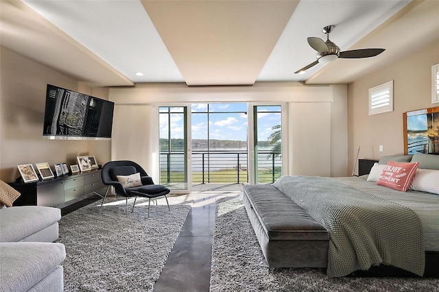 bedroom with ceiling fan and access to exterior