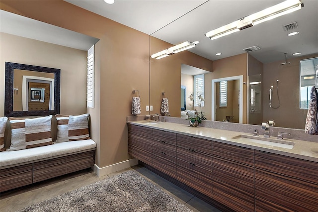 bathroom with tile patterned flooring and vanity