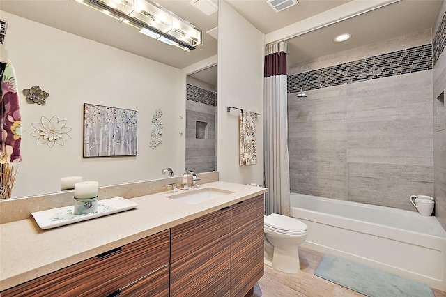 full bathroom with toilet, tile patterned flooring, shower / bath combo, and vanity