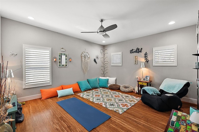 interior space featuring ceiling fan, plenty of natural light, and hardwood / wood-style flooring