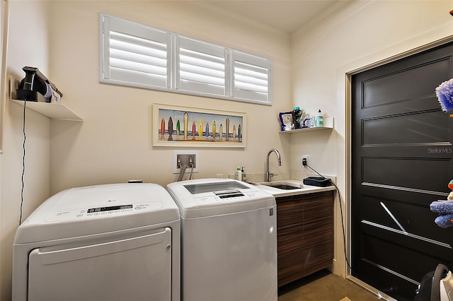 laundry area with washer and clothes dryer and sink