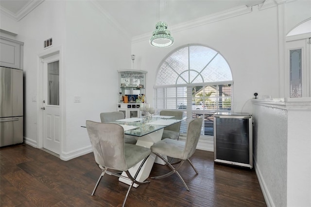 dining space with wine cooler, dark wood-type flooring, and ornamental molding