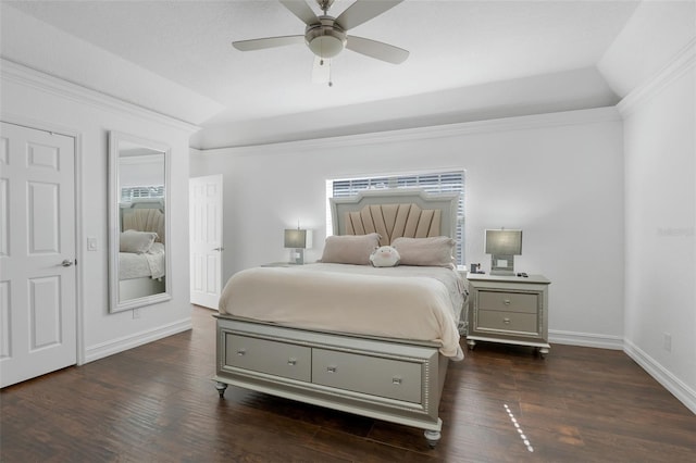 bedroom with ceiling fan, lofted ceiling, dark hardwood / wood-style floors, and crown molding