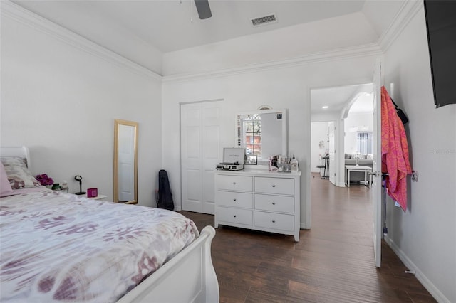 bedroom with ceiling fan, a closet, and dark hardwood / wood-style floors