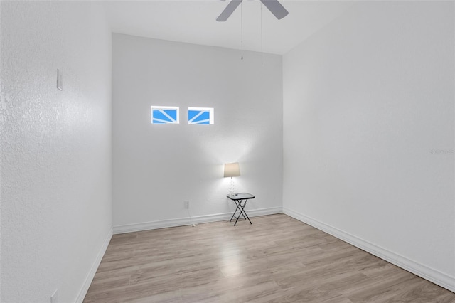 unfurnished room with ceiling fan and light wood-type flooring