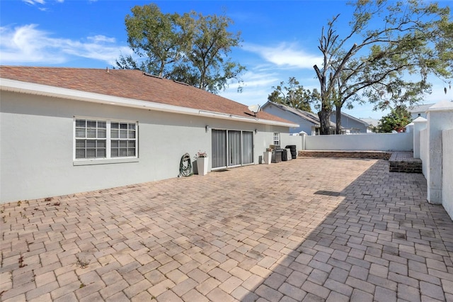 back of house with a patio area