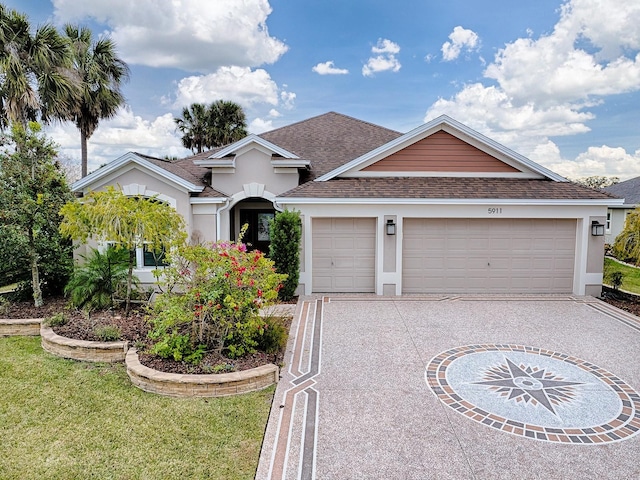 ranch-style house featuring a front yard and a garage