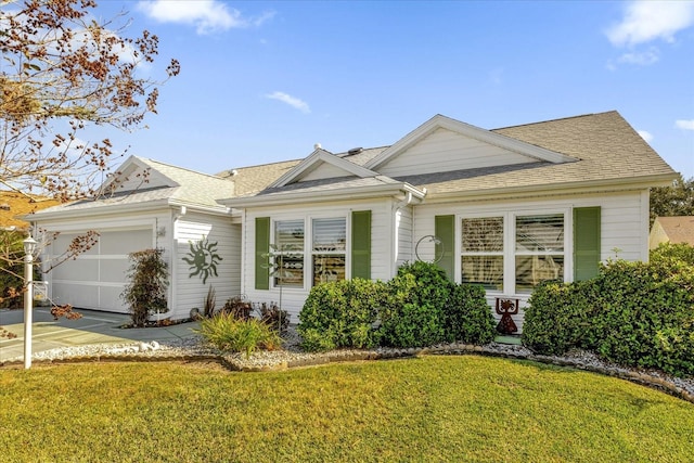 ranch-style house with a front yard and a garage