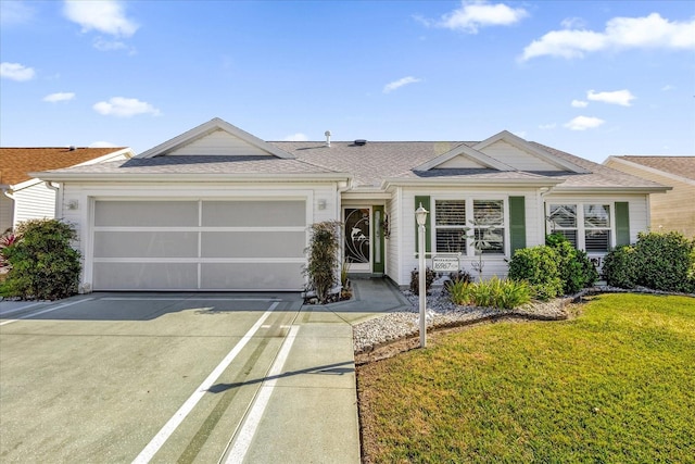 ranch-style house with a front yard and a garage