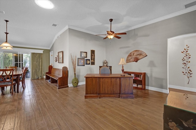 office featuring wood-type flooring, a textured ceiling, crown molding, and ceiling fan