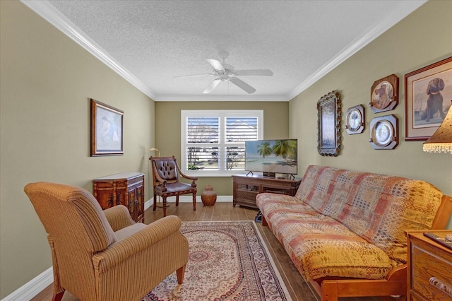 living room with crown molding, a textured ceiling, and light hardwood / wood-style floors