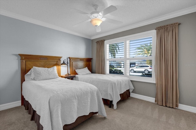 carpeted bedroom with ceiling fan, crown molding, and a textured ceiling