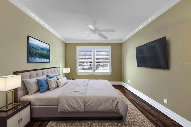 bedroom with crown molding, dark wood-type flooring, and ceiling fan