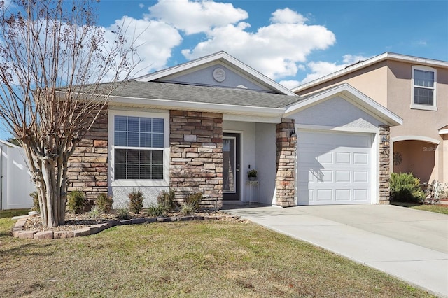 ranch-style home with a garage and a front lawn