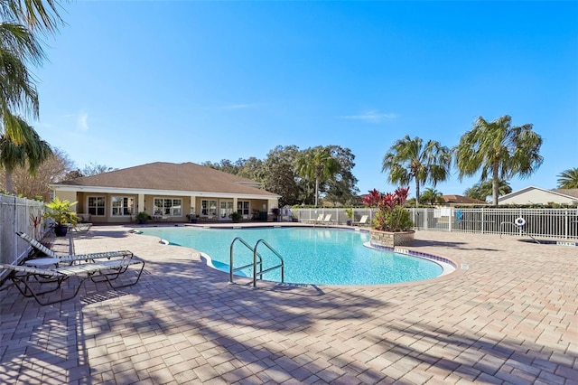 view of swimming pool with a patio