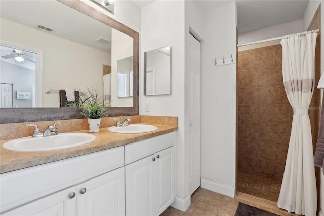 bathroom featuring vanity, tile patterned floors, ceiling fan, and a shower with shower curtain