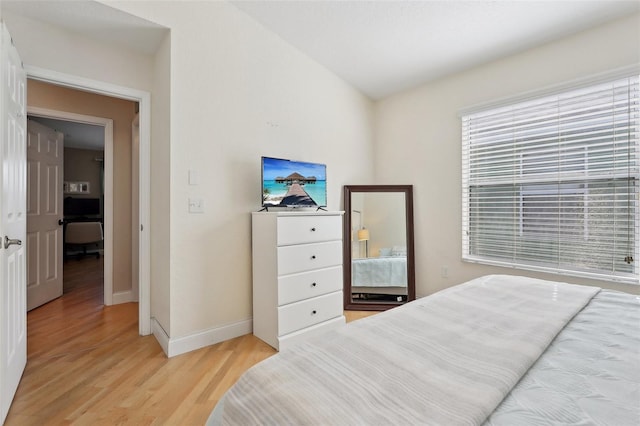 bedroom with light hardwood / wood-style flooring