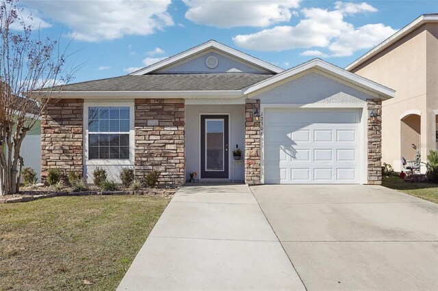 ranch-style house with stone siding, concrete driveway, a garage, a front yard, and a shingled roof