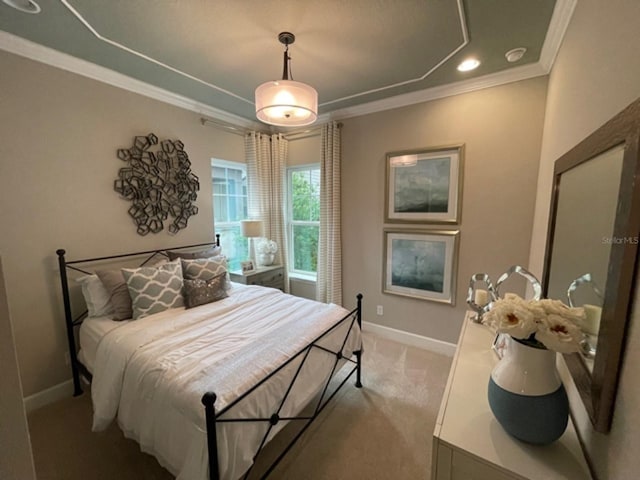 carpeted bedroom featuring crown molding