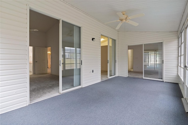 unfurnished sunroom featuring lofted ceiling and ceiling fan