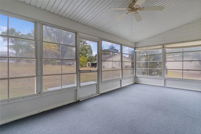 unfurnished sunroom with vaulted ceiling and ceiling fan