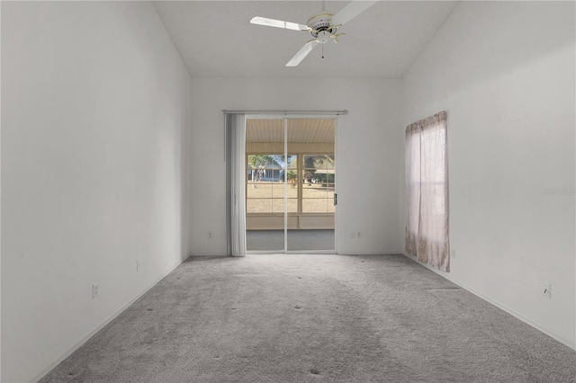 empty room with ceiling fan, a healthy amount of sunlight, and light carpet