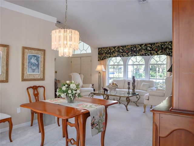 dining room featuring a chandelier, carpet floors, visible vents, and baseboards