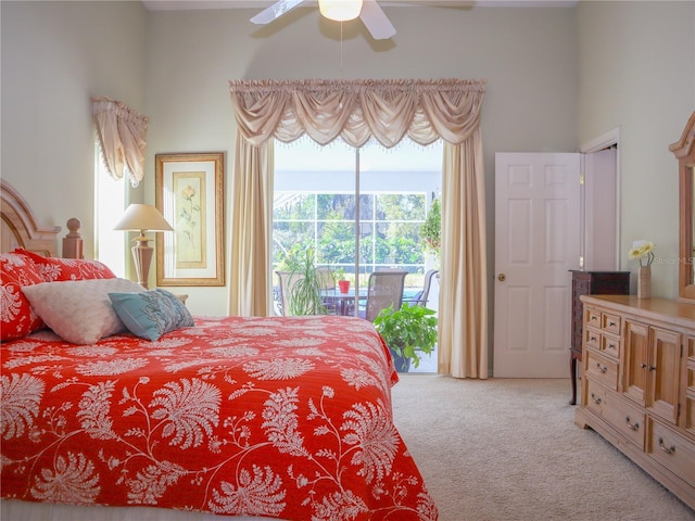 bedroom featuring access to outside and light colored carpet