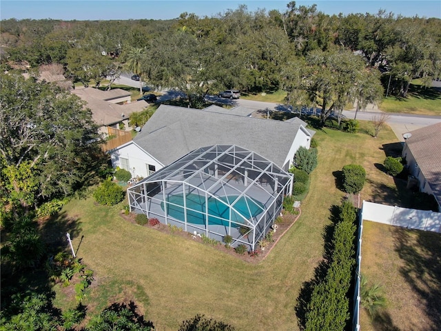 birds eye view of property featuring a wooded view