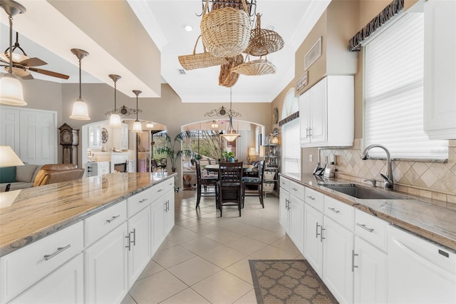 kitchen featuring white cabinetry, sink, pendant lighting, and white dishwasher