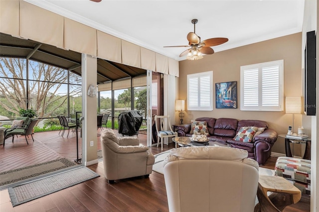 living room featuring dark hardwood / wood-style flooring, a wealth of natural light, and ceiling fan