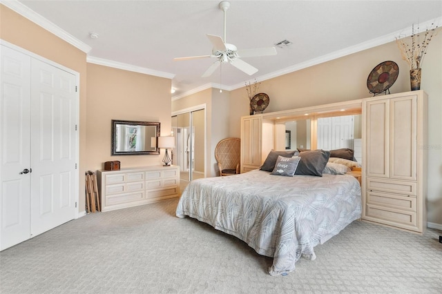 carpeted bedroom with multiple closets, ornamental molding, and ceiling fan