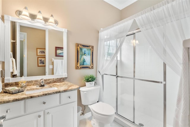 bathroom with vanity, toilet, tile patterned flooring, and a shower with door