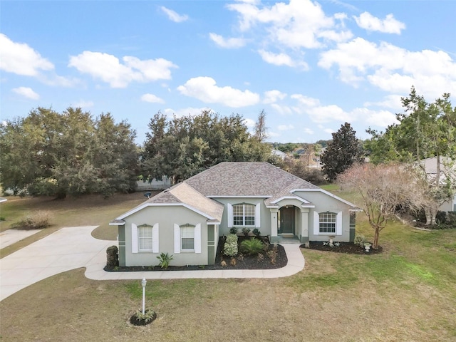 ranch-style home featuring a front yard