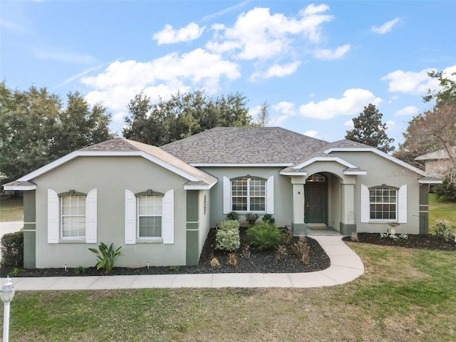 single story home with a front yard