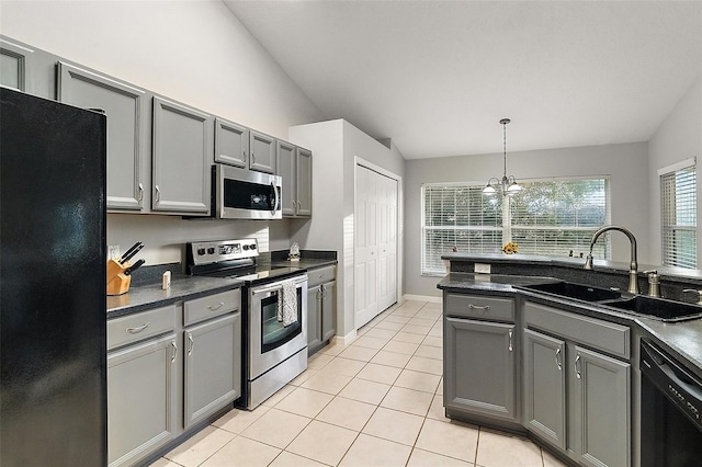 kitchen with sink, black appliances, gray cabinetry, and vaulted ceiling