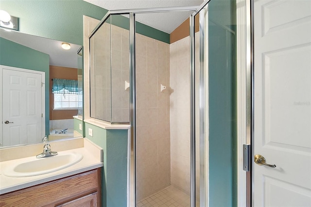 bathroom with vanity and separate shower and tub