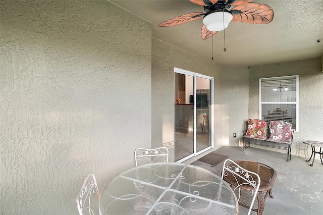 sunroom / solarium with ceiling fan