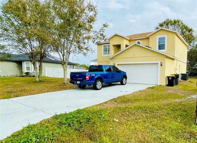 view of front facade with central AC unit, a front lawn, and a garage