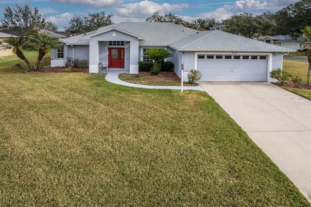 ranch-style home featuring a front yard and a garage