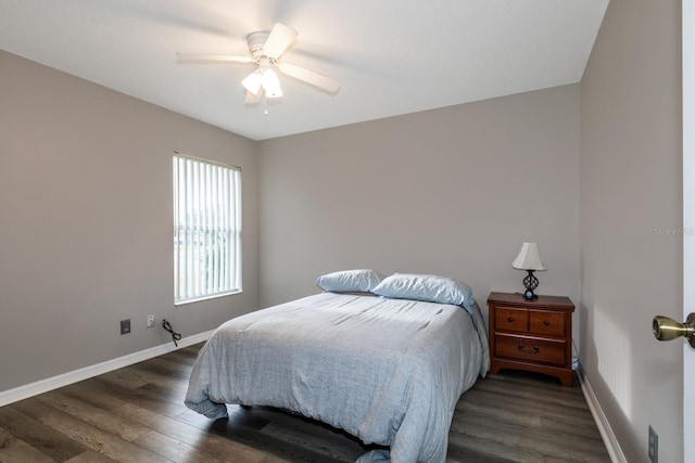 bedroom featuring ceiling fan and dark hardwood / wood-style flooring