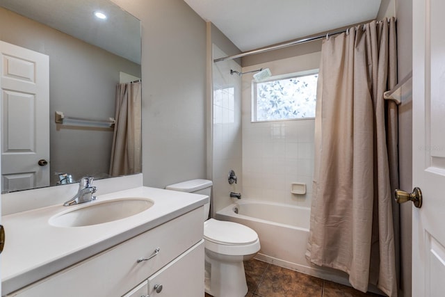 full bathroom featuring shower / bath combo with shower curtain, toilet, tile patterned floors, and vanity