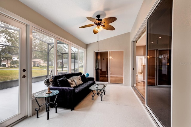 sunroom / solarium with ceiling fan and vaulted ceiling