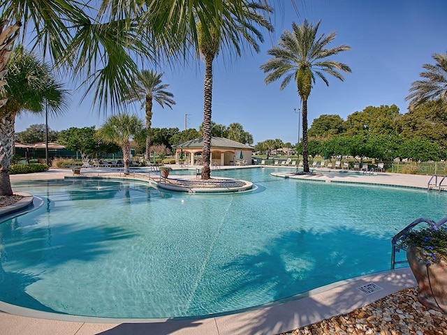 view of pool featuring a hot tub