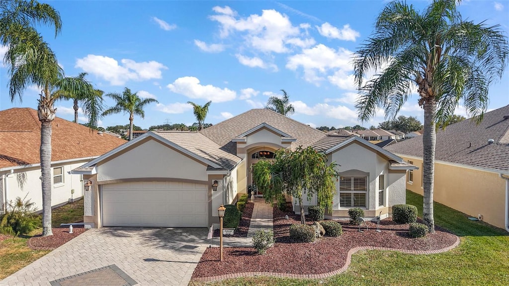 ranch-style home featuring a garage