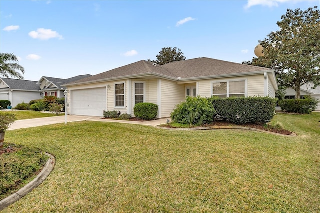 ranch-style home with a garage and a front lawn