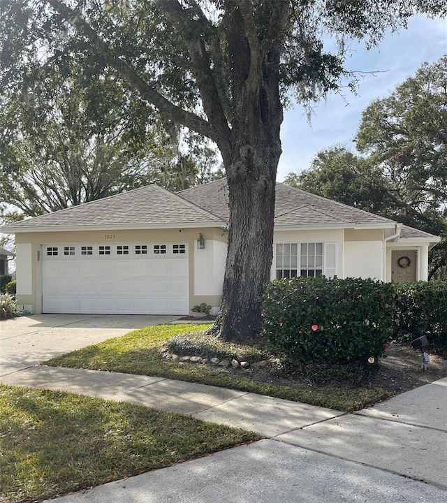 single story home featuring a garage